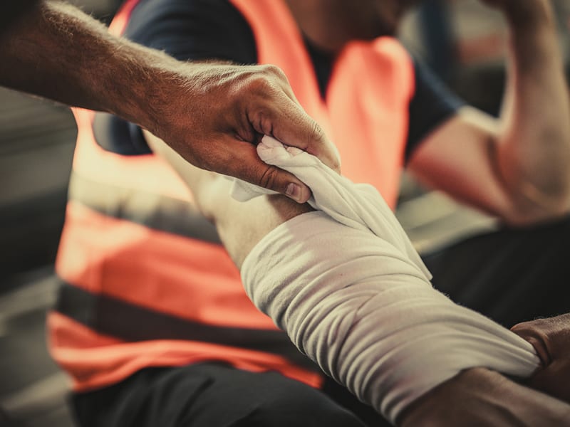 Worker's arm is wrapped after a workplace injury.