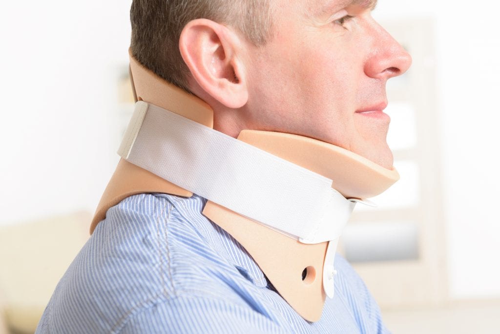 Man with a neck injury wearing a cervical collar. There are many types of accidents that fall under the personal injury law umbrella.